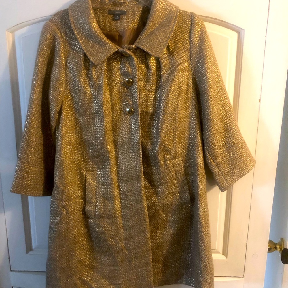 This is a gently used gold 3/4 length sleeve pea coat.